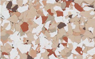 A close-up of scattered, irregularly-shaped beige, brown, and white flakes on a flat surface.