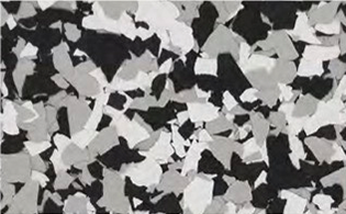 A close-up view of a surface with a speckled black, white, and gray flake pattern.