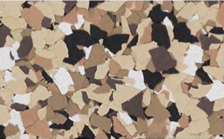 A close-up of a surface covered in small, irregular tan, brown, black, and white flakes.